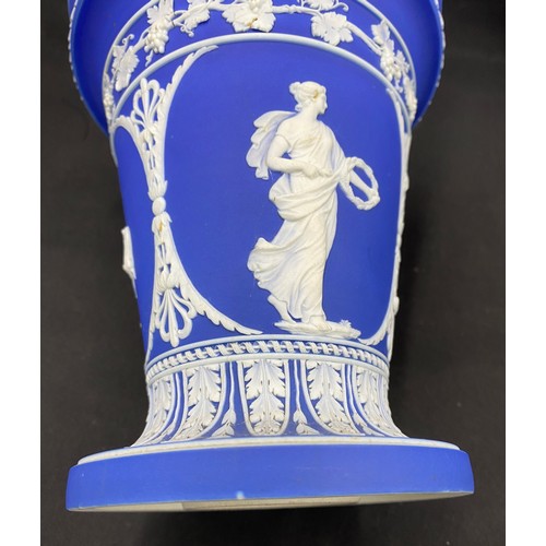 157 - A quantity of blue Wedgwood to include two twin handled vases, 20cms high, a planter 18.5 diameter, ... 