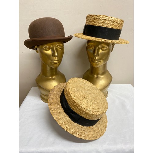 497 - Three vintage hats to include a Dunn & Co size  7 1/4 brown bowler hat and two straw boaters by The ... 