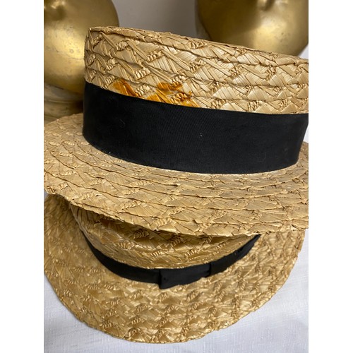 497 - Three vintage hats to include a Dunn & Co size  7 1/4 brown bowler hat and two straw boaters by The ... 