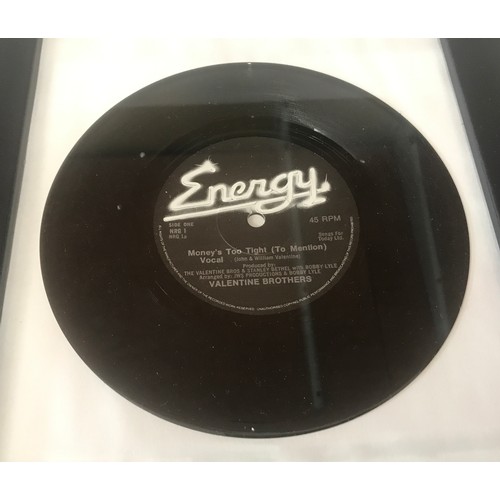 798 - Two framed 45 rpm vinyl singles- Wigans Ovation 'Skiing in The Snow' and Valentine Brothers 'Money's... 