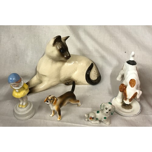 180 - A small collection of ceramic animals to include Royal Doulton: feeding dog 13 cm h and a sitting ca... 