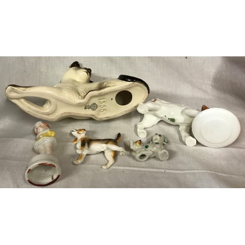 180 - A small collection of ceramic animals to include Royal Doulton: feeding dog 13 cm h and a sitting ca... 