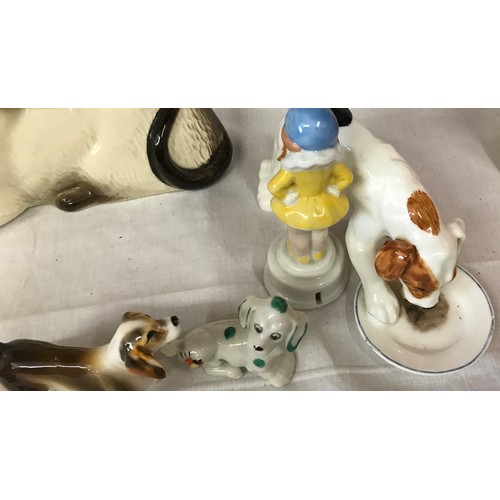 180 - A small collection of ceramic animals to include Royal Doulton: feeding dog 13 cm h and a sitting ca... 