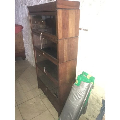 1202 - Oak four height fold over door bookcase, drawer to base, glass shelves. 157 h x 87 w x 29cm d.