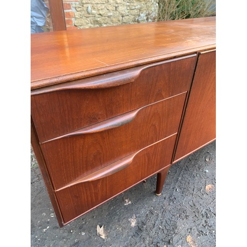 1205 - A Mcintosh sideboard, three drawers and two cupboard, one dropdown with slide out shelf. 201 l x 45 ... 