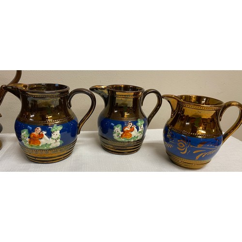 115 - 19thC Copper lustre ware to include 7 x jugs, 2 x teapots and 2 x mugs.