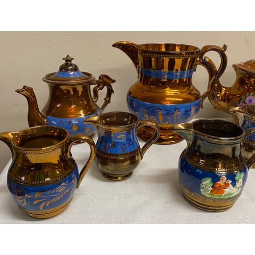 115 - 19thC Copper lustre ware to include 7 x jugs, 2 x teapots and 2 x mugs.