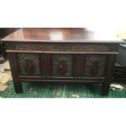 1122 - Seventeenth century oak coffer with inlaid front panels. 124 w x 57 d x 73cm h.