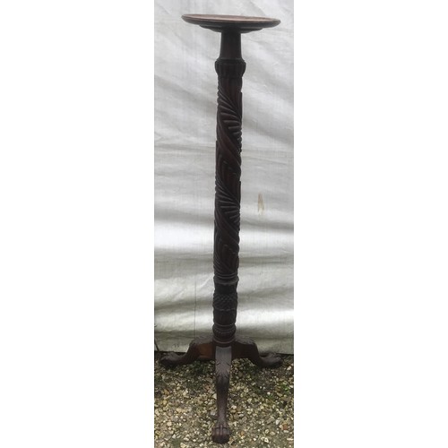 1123 - Tall mahogany carved stem torchere stand on tripod claw and ball feet. 145cm h.