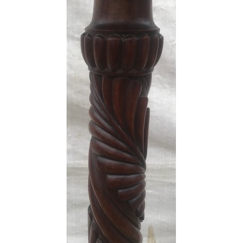 1123 - Tall mahogany carved stem torchere stand on tripod claw and ball feet. 145cm h.