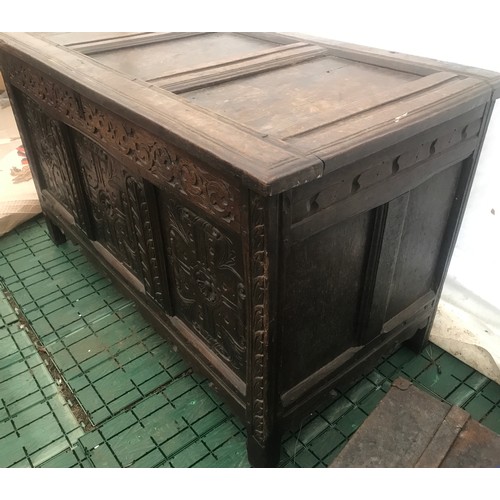 1128 - Eighteenth century oak coffer, carved panels to front, 123 w 60 d x 71cm h.