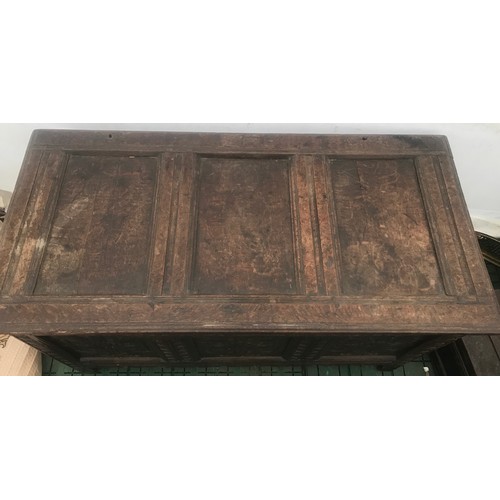 1128 - Eighteenth century oak coffer, carved panels to front, 123 w 60 d x 71cm h.