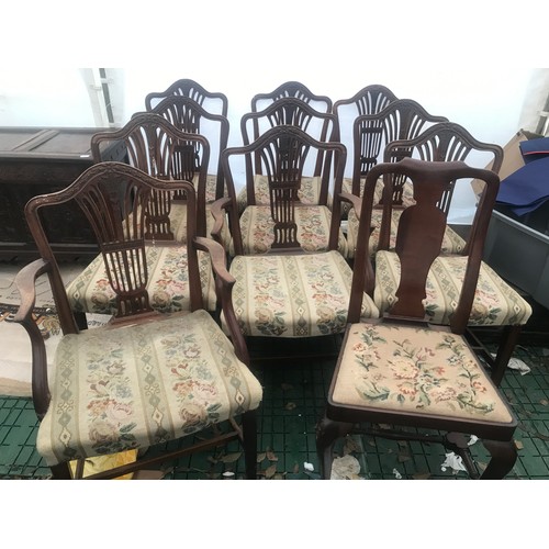 1129 - Set of 10 oak dining chairs, 8 dining and 2 carver chairs, carved backs, woolwork upholstered seats,... 