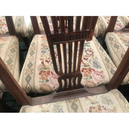 1129 - Set of 10 oak dining chairs, 8 dining and 2 carver chairs, carved backs, woolwork upholstered seats,... 