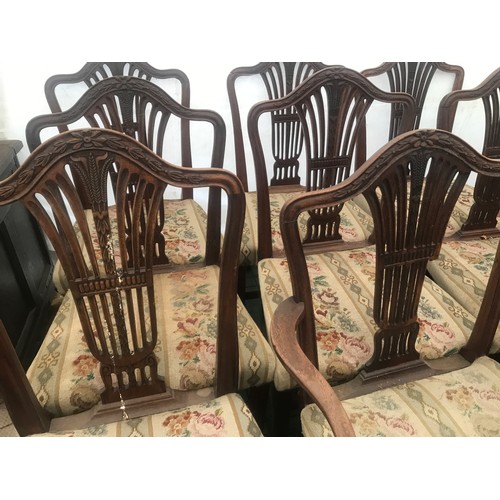 1129 - Set of 10 oak dining chairs, 8 dining and 2 carver chairs, carved backs, woolwork upholstered seats,... 