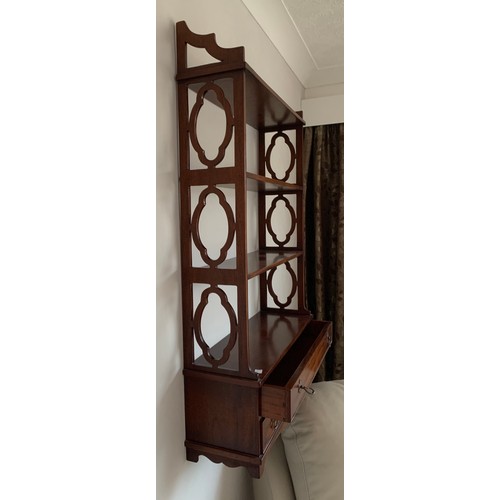 1142 - A wall hanging shelf unit in mahogany with 2 drawers to base. 108 x 70 x 20cm.