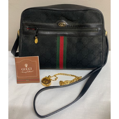 504 - A vintage Gucci handbag and Gucci pendant scent bottle in original tissue.