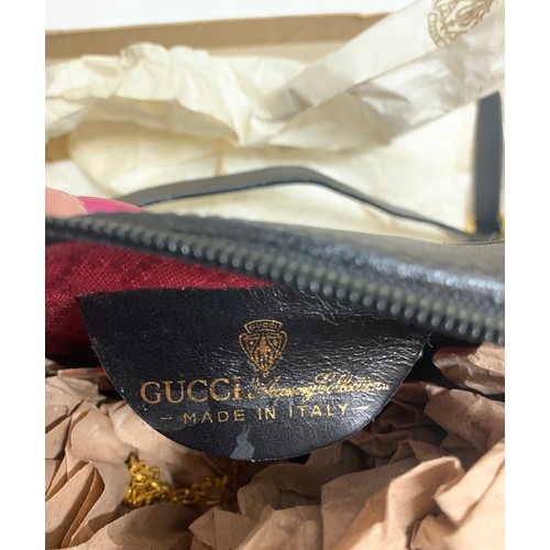 504 - A vintage Gucci handbag and Gucci pendant scent bottle in original tissue.