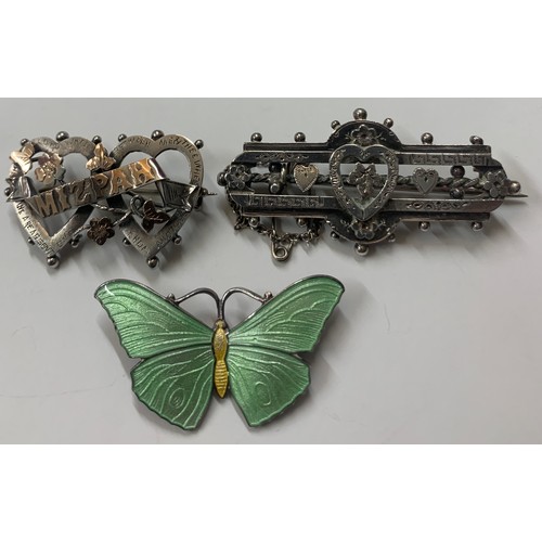 435 - Three silver brooches to include sterling silver and enamel butterfly, Mizpah brooch Birmingham 1902... 