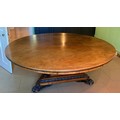 A superb 19thC walnut circular dining table in the manner of Thomas Hope. Made from one piece of woo... 