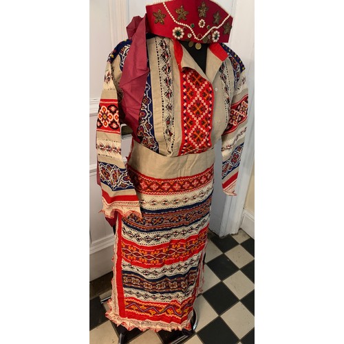 506 - Vintage Russian folk costume to include silk skirt, apron, shirt headdress together with a silk embr... 