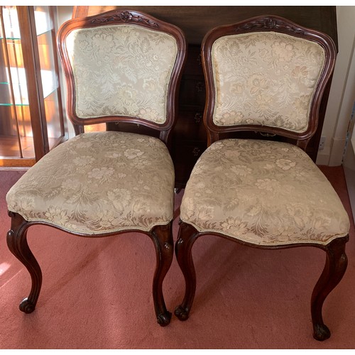 1154 - Two mahogany upholstered side chairs on cabriole legs.