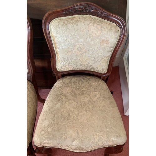 1154 - Two mahogany upholstered side chairs on cabriole legs.