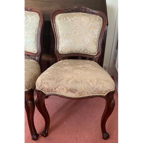 1154 - Two mahogany upholstered side chairs on cabriole legs.