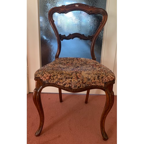 1157 - A 19thC rosewood balloon backed side chair with shaped back and cabriole legs.