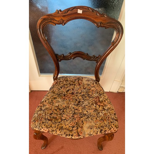 1157 - A 19thC rosewood balloon backed side chair with shaped back and cabriole legs.