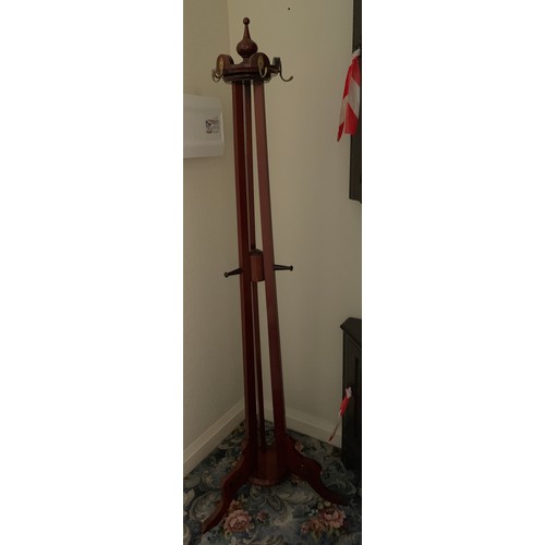 1159 - A 19thC hall stand with swivel top with brass hooks. 185cm h.