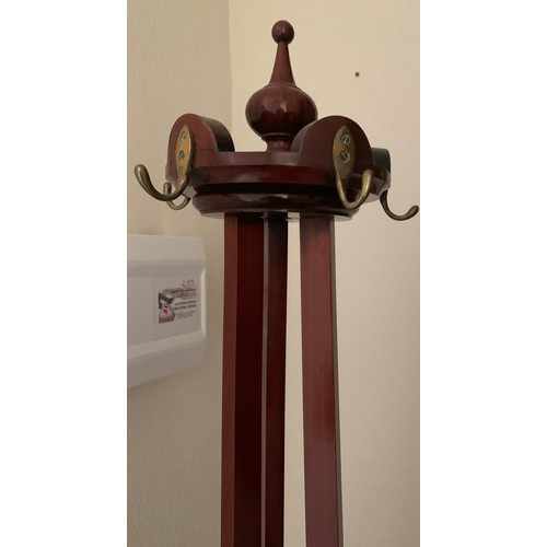 1159 - A 19thC hall stand with swivel top with brass hooks. 185cm h.