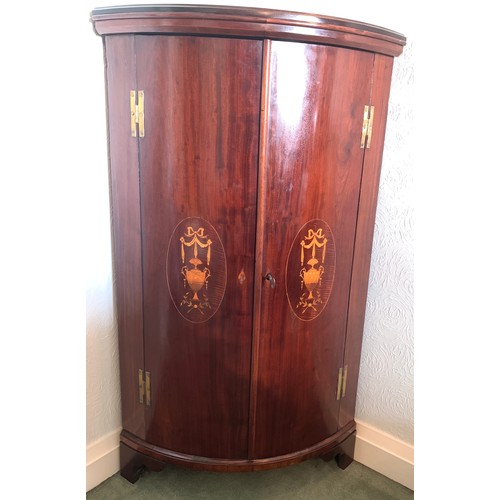 1166 - Mahogany and inlaid bow fronted corner cupboard. 118 h x 69cm w.