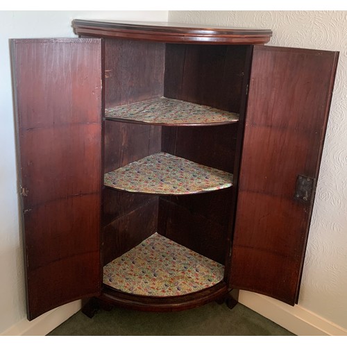 1166 - Mahogany and inlaid bow fronted corner cupboard. 118 h x 69cm w.