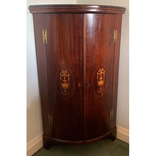 1166 - Mahogany and inlaid bow fronted corner cupboard. 118 h x 69cm w.