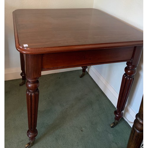 1167 - A square mahogany side table on reeded legs and brass castors. 77 x 77 x 75cm h.