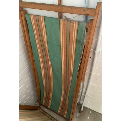 1168 - Four vintage deck chairs.