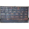 A 19thC pine 38 drawer drug run/chest with gilt and black labels and glass knobs to all drawers. 193... 