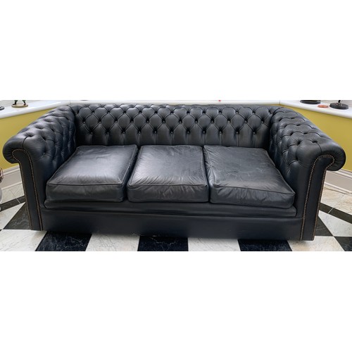 1172 - A pair of black leather button backed Chesterfield sofas. 190 l x 65 h x 87 d.