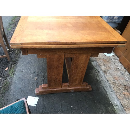 1173 - An Art Deco oak dining room suite, draw leaf table 106 w x closed 91cm x 76cm h, 4 chairs and a side... 