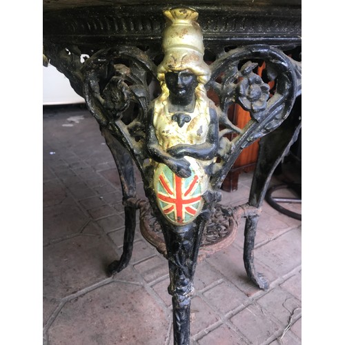 1279 - Circular cast iron pub table, Britannia and Lion heads base, N.E.B Ltd, Sunderland, mahogany top 65 ... 