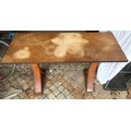 Oak quarter veneered hall table on X frame pedestals. 122 l x 51 d x 77cm h.