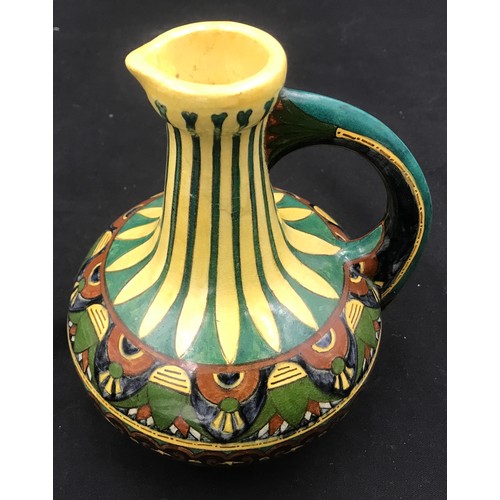 96 - Decorative pottery jug Faience de Purmerende Hollande, numbered 1023 to the base. 18cm h.