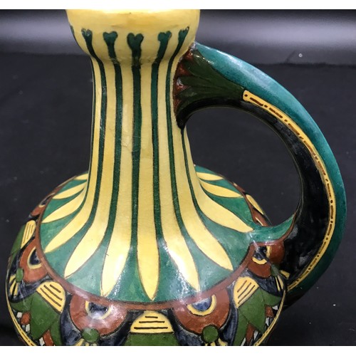 96 - Decorative pottery jug Faience de Purmerende Hollande, numbered 1023 to the base. 18cm h.