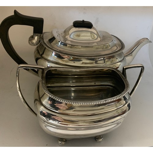 454 - A silver teapot with ebony knop and handle with sugar bowl. Sheffield 1907 maker Jay, Richard Attenb... 