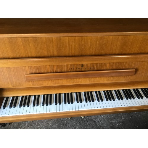 790 - A Steinway and Sons upright piano 146 w x 59 d x 114cm h and a piano stool and contents.