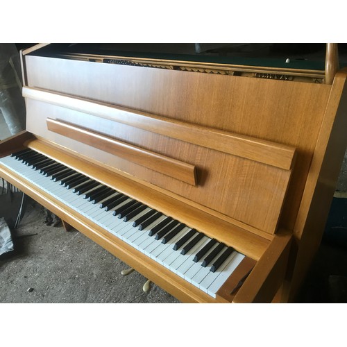 790 - A Steinway and Sons upright piano 146 w x 59 d x 114cm h and a piano stool and contents.