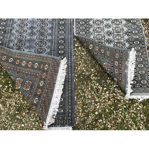 515 - Two grey patterned rugs 160 l x 97cm w and 120 x 80cm.