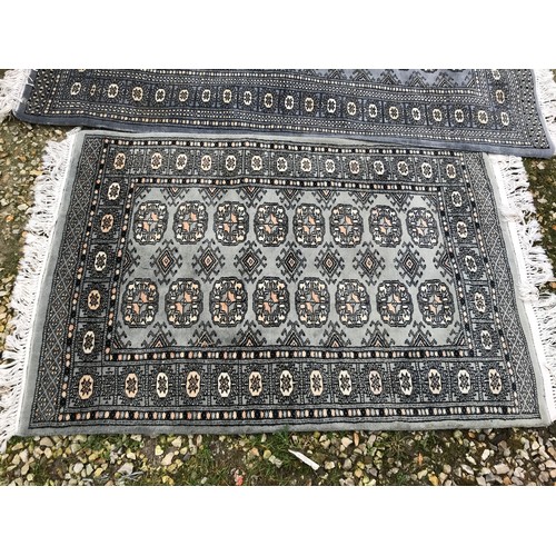 515 - Two grey patterned rugs 160 l x 97cm w and 120 x 80cm.