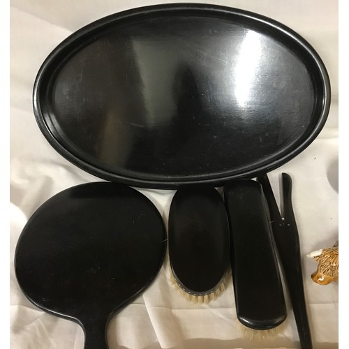 107 - Mixed lot to include ebony dressing table tray 36cm w with a vanity mirror and brush set with glove ... 